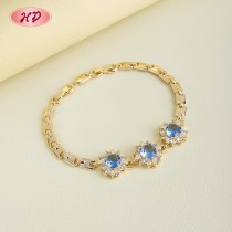 Elegant Blue CZ Floral Link Bracelet | 18K Gold Plated Wholesale Jewelry