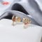 Wholesale 18K Gold Plated Floral Crescent Moon Huggie Earrings with Pink Baguette CZ | Factory Direct Manufacturer