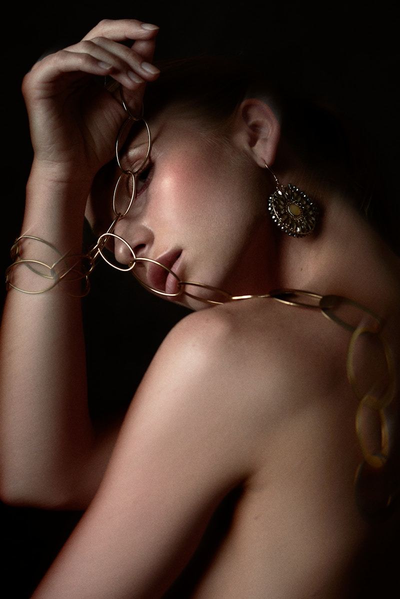 Woman wearing elegant gold necklace in natural light