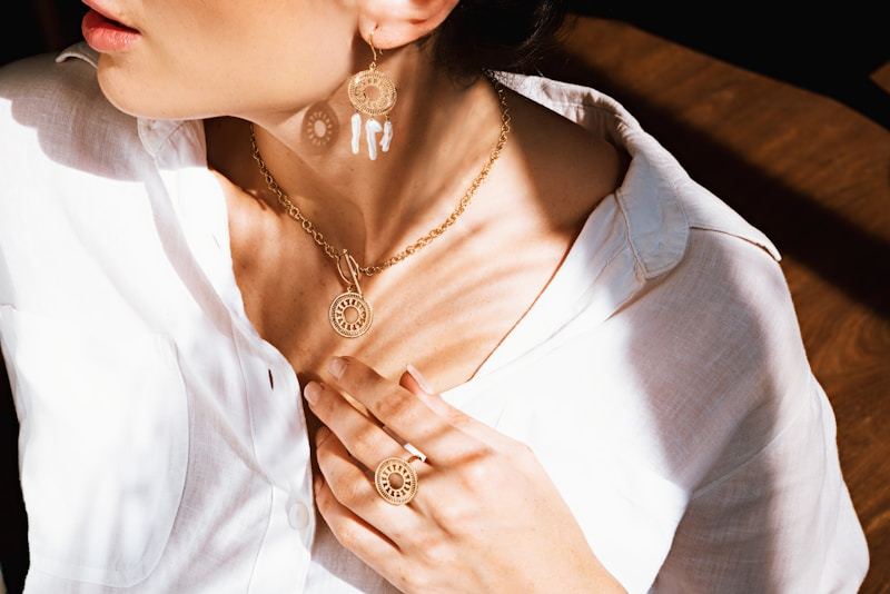 Woman in white shirt wearing gold necklace for everyday elegance