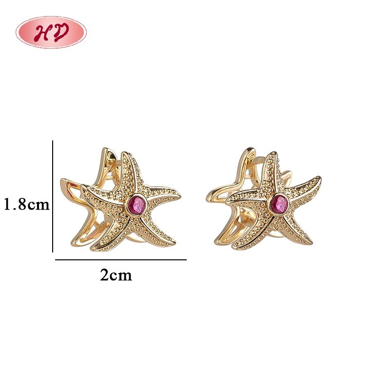 Delicate gold huggie hoop earring view 1