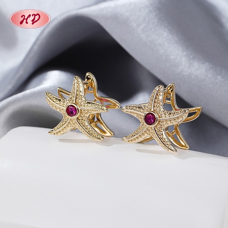 Delicate gold huggie hoop earring view 4