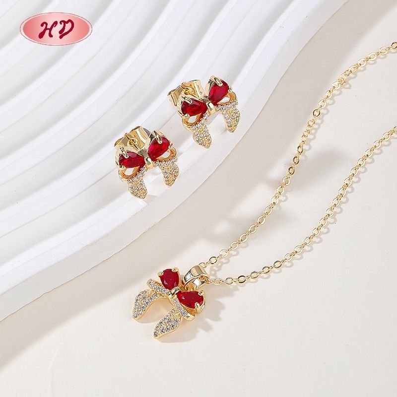 Parure nœud papillon avec zircones multicolores plaquée or 18K
