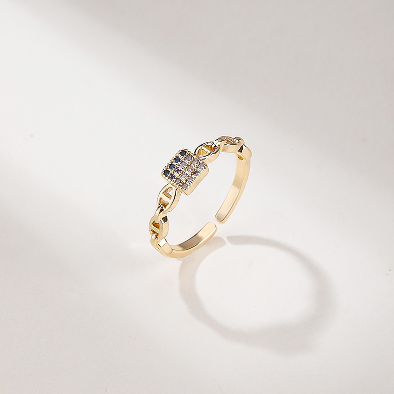 18K gold tone CZ ring styled for retail display