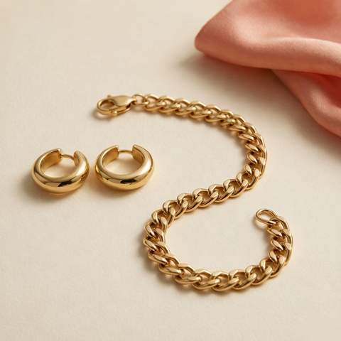 Premium 18K gold plated chain bracelet with huggie hoops on cream background