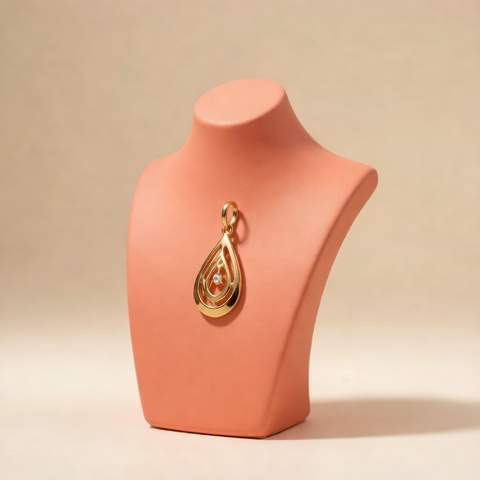 18K gold plated pendant on a coral jewelry bust