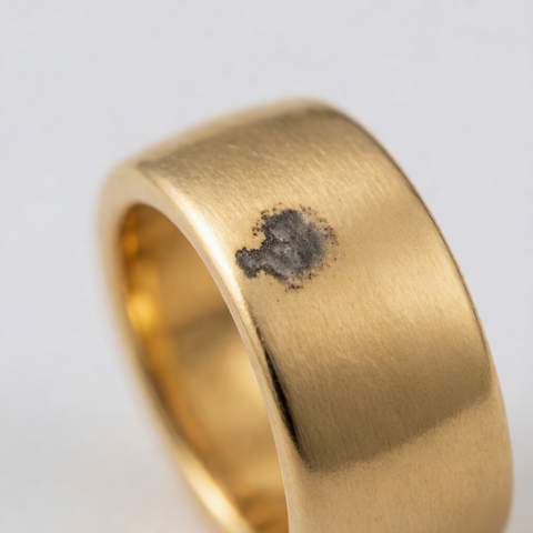 Close-up of oxidation spot on gold plated jewelry