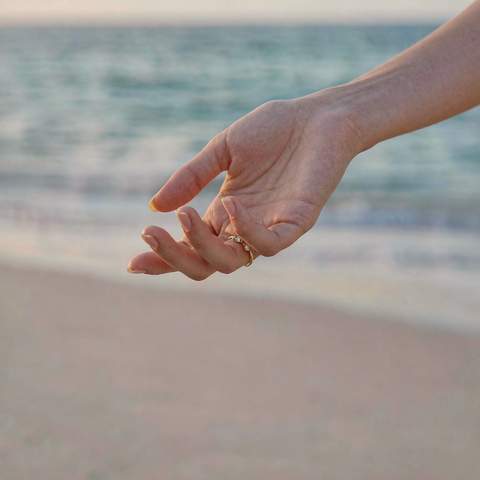 Removing a gold plated ring before entering the ocean