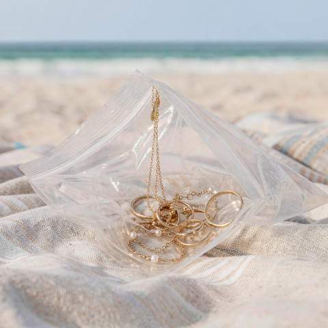 Gold plated jewelry stored in an OPP pouch after a beach day