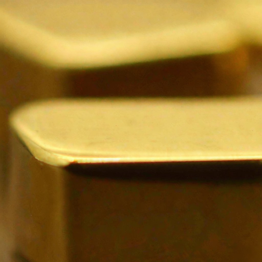 Close-up of 18K gold plating layer over brass