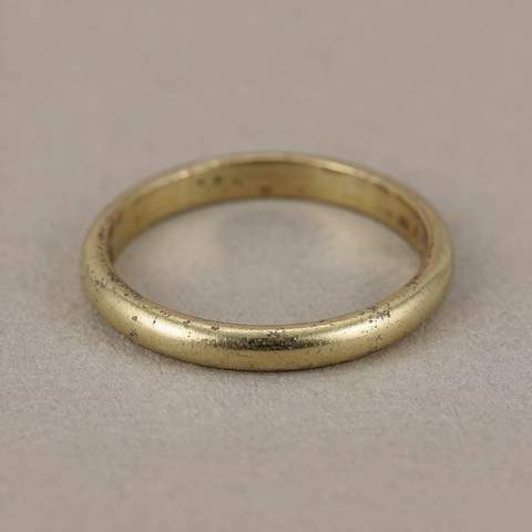 Close-up of an 18K gold plated ring showing wear