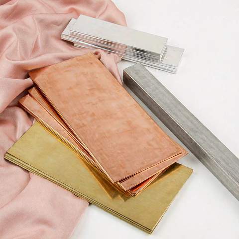 Raw jewelry base metal samples: brass, copper, stainless steel and sterling silver swatches