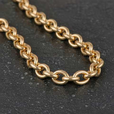 Macro detail of a thick gold filled cable chain showing the bonded gold layer