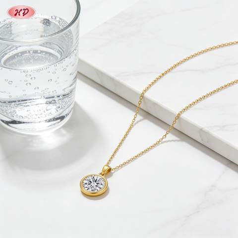 18K gold plated necklace on a neutral background