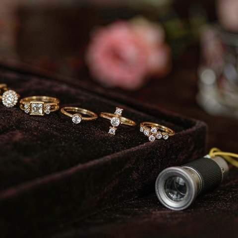 Quality inspection of gold plated jewelry with a magnifying loupe