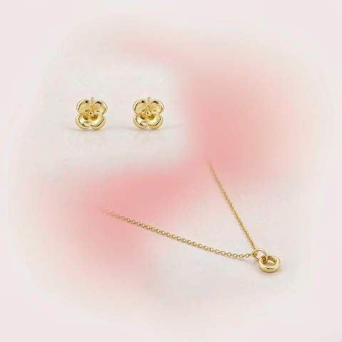 Gold plated earrings and necklace stored separately, not touching