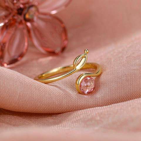 Gold plated ring resting on soft fabric, showing everyday contact surfaces