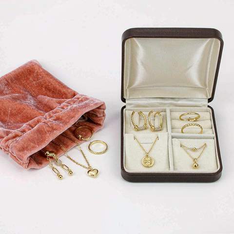Gold plated jewelry stored separately in a pouch and a lined box