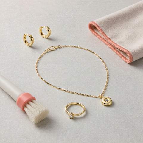 Care kit for gold plated jewelry with a soft brush and cloth