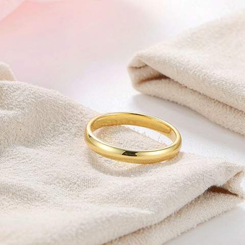 Gold plated ring resting on a soft polishing cloth