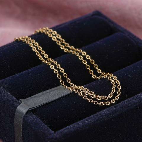 Gold plated chain necklace in a velvet jewelry tray