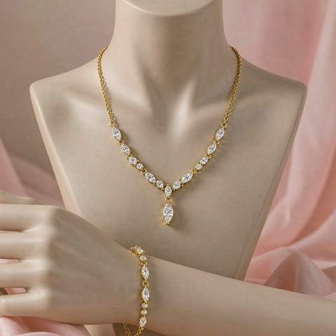 Finished gold plated necklace and bracelet displayed on a bust
