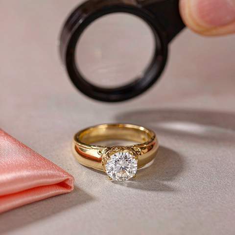Inspecting an 18K gold plated ring with a jeweler's loupe