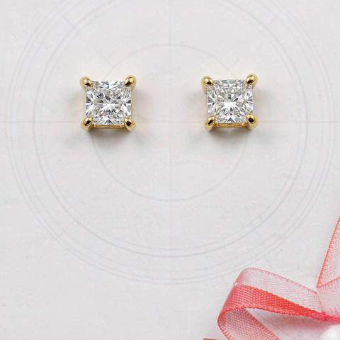 Cubic zirconia stud earrings laid out for quality inspection
