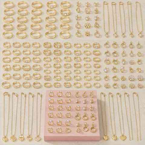 Wide display of gold plated rings, earrings and necklaces showing catalog variety