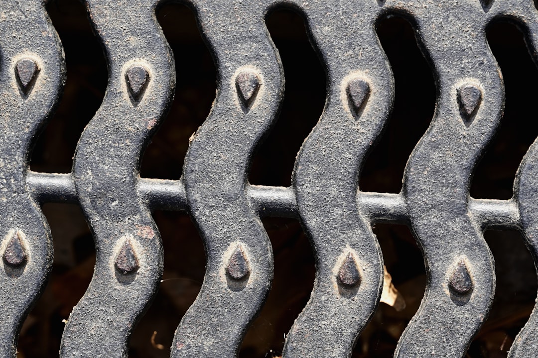 Close-up of a raw steel spider table leg showing the weld and texture