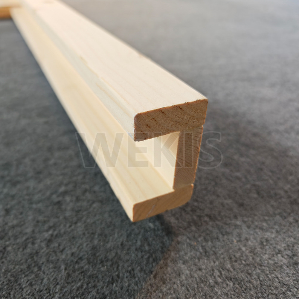 Top view of the aluminum track channel embedded in the wooden frame rail