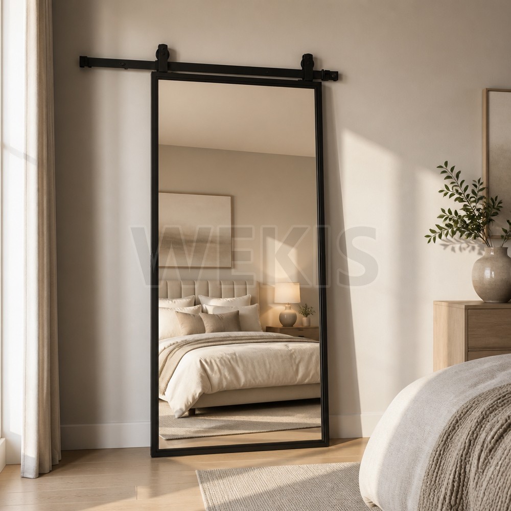 Mirror barn door used as a feature panel in a styled bedroom