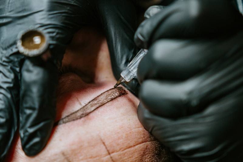 PMU machine close-up during permanent makeup procedure