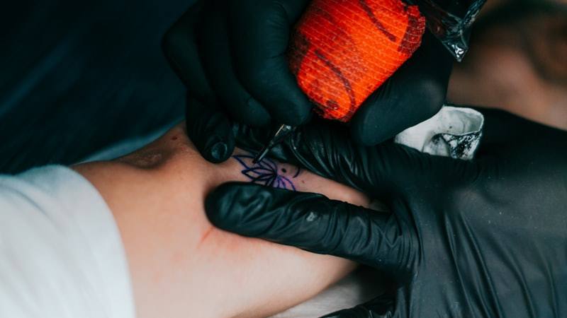 Tattoo artist machine close up during procedure