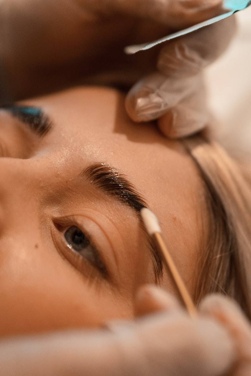 Microblading pigment application with gloves and microblade