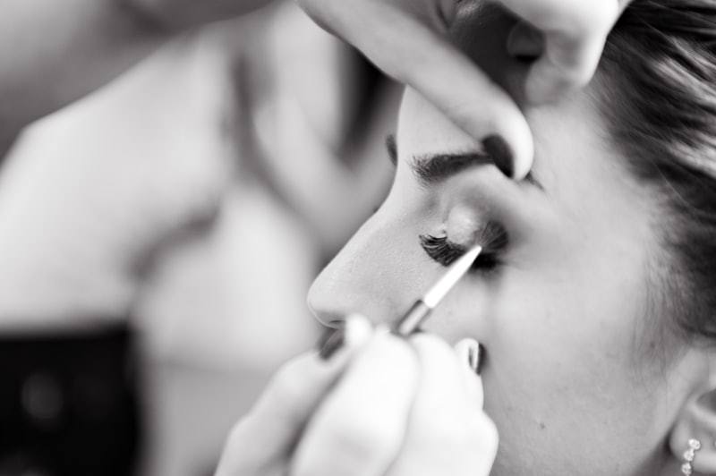 PMU artist performing procedure with gloves for sterile permanent makeup pigment