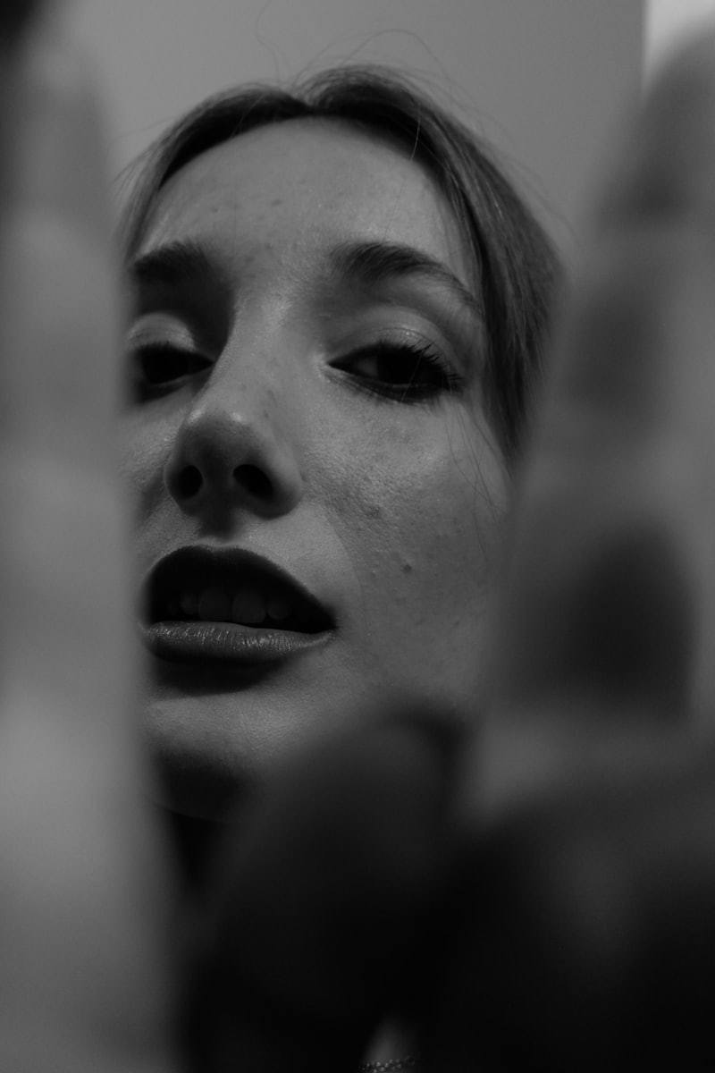 Black and white close-up portrait of woman face makeup