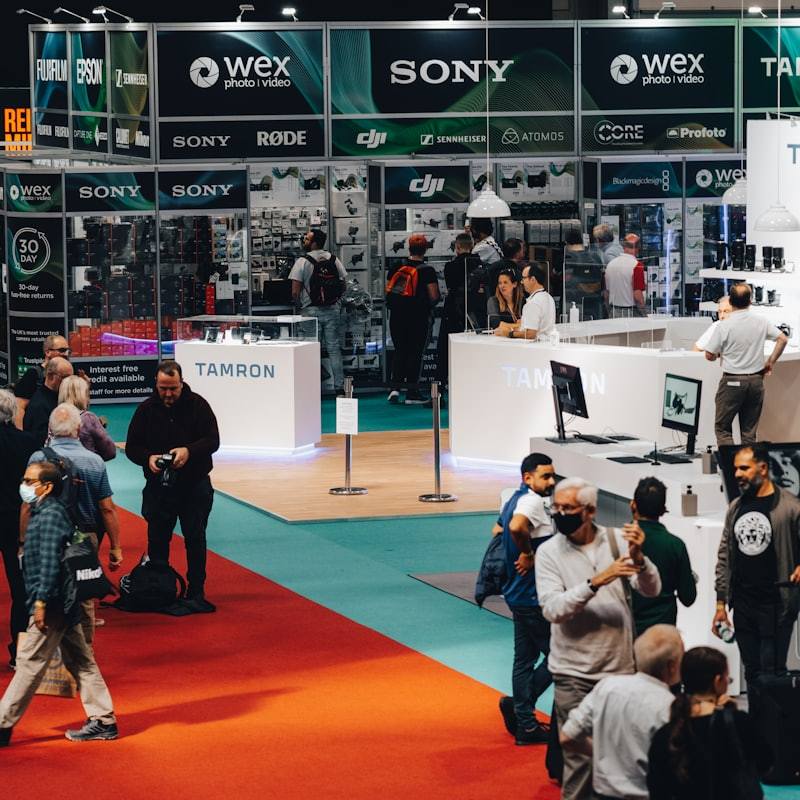 Large trade show floor with brand booths and visitors