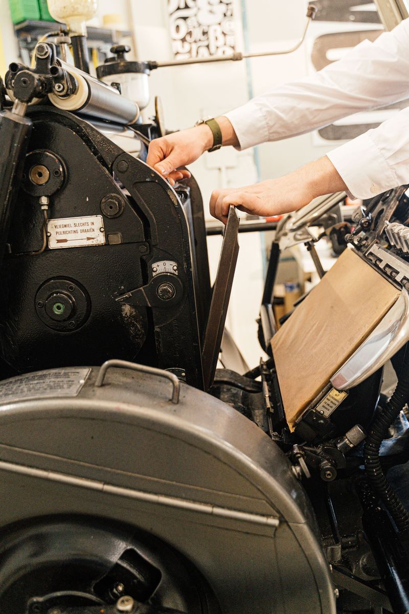 Person operating industrial printing machine