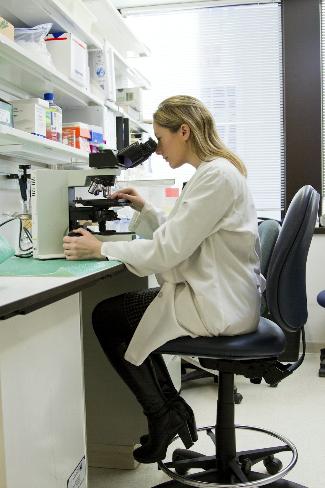 Scientist working with a laboratory microscope