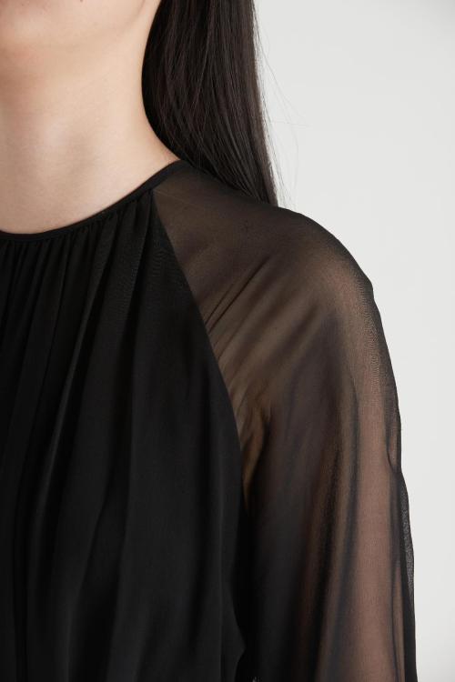Black sloping shoulder loose fitting long sleeve dress
