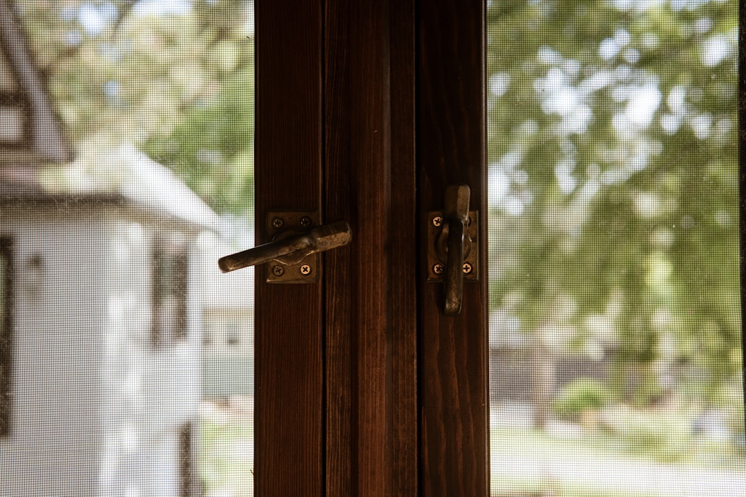 Close-up of a realistic Rosewood woodgrain effect on a uPVC window frame