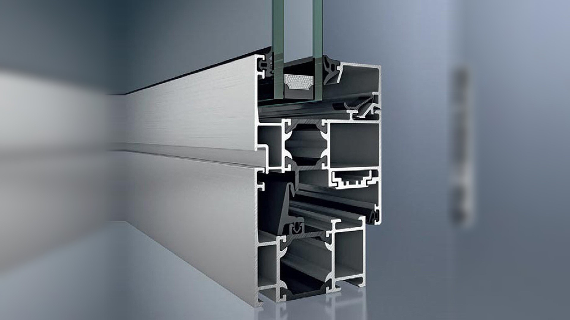 Thermally broken aluminium door profile section with the black polyamide thermal barrier and a double-glazed unit