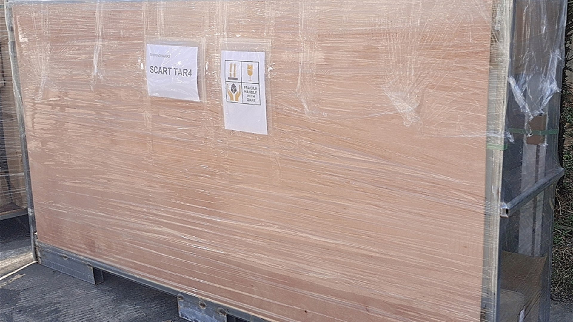 Timber crates strapped inside an export container before shipment from Fuzhou