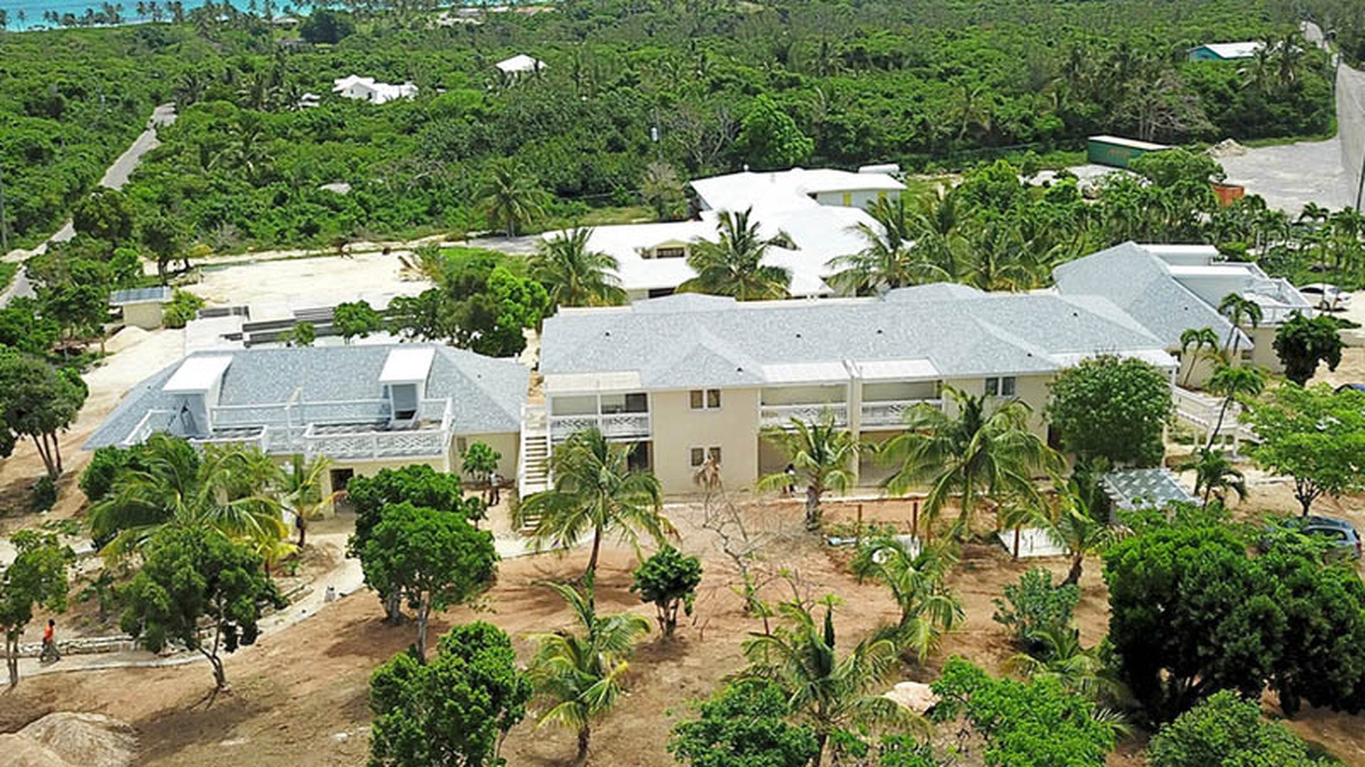 A multi-unit coastal development fitted out with custom windows and doors across every block.