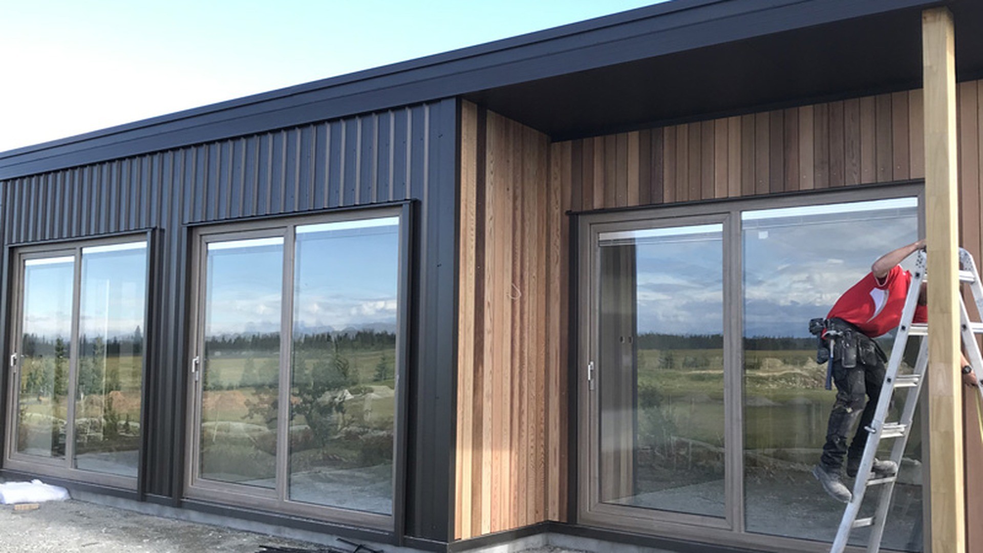 Large glazed sliding doors going into a commercial building during the fit-out stage.