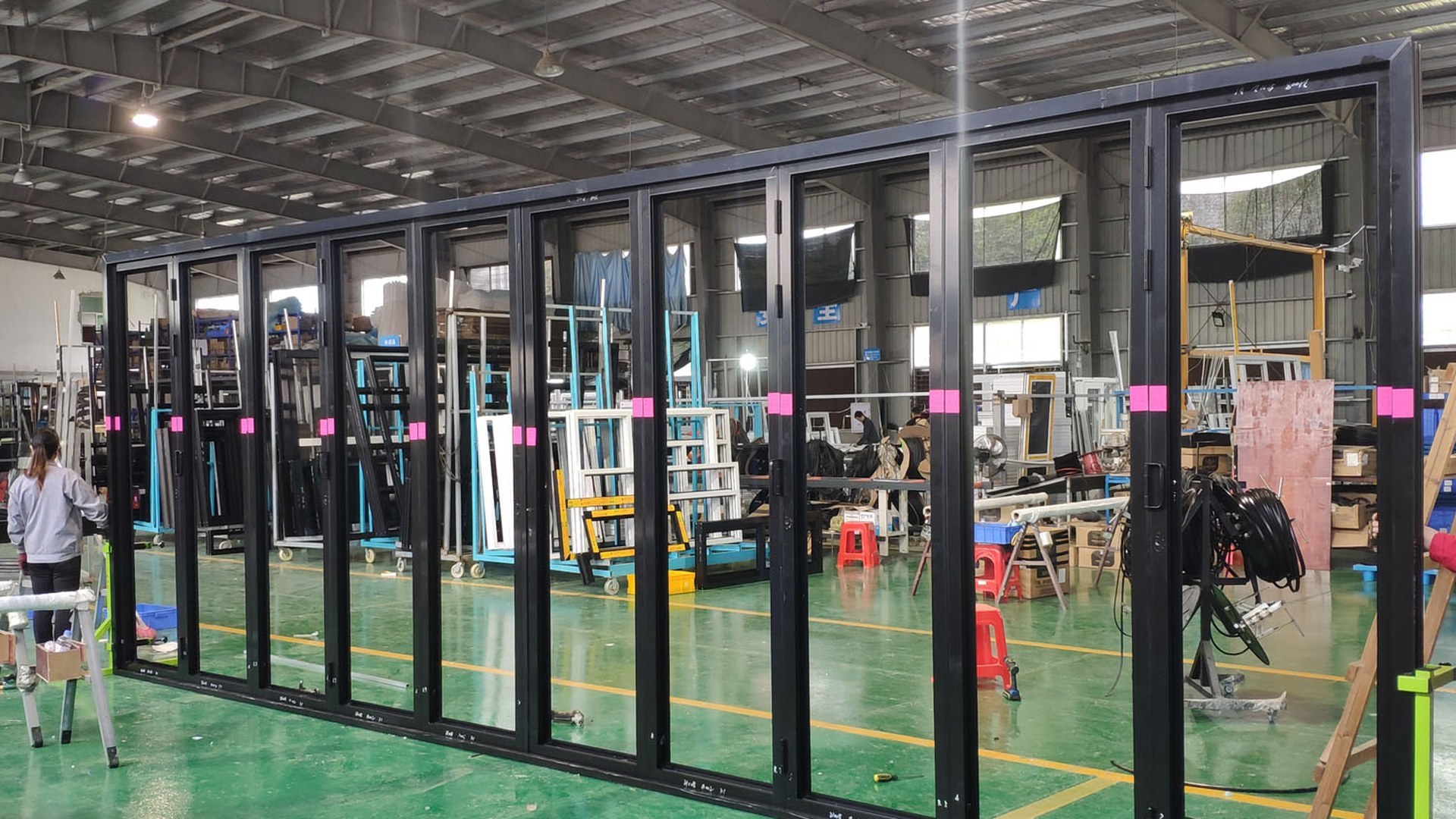 Folding door units assembled and checked in the workshop before packing and shipment.