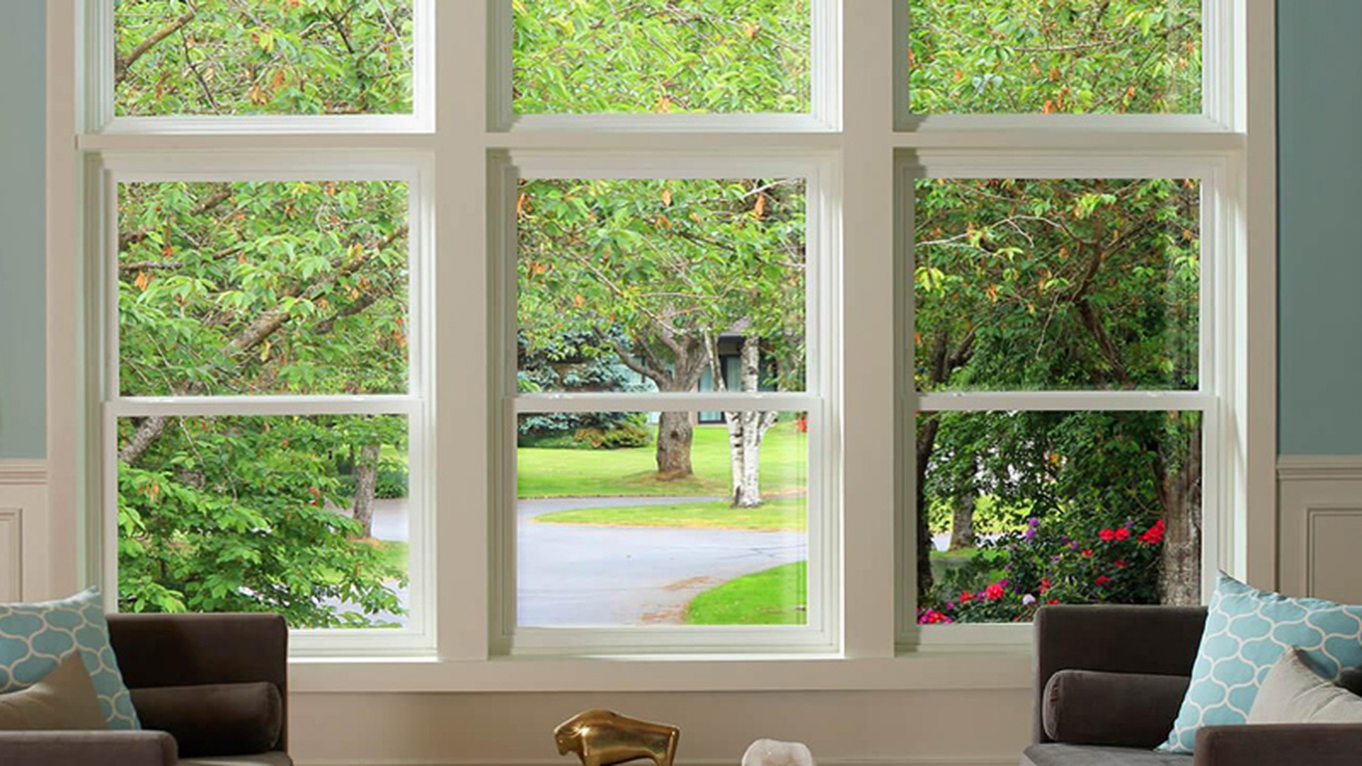Installed multi-light windows in a North American home, looking out over the garden.