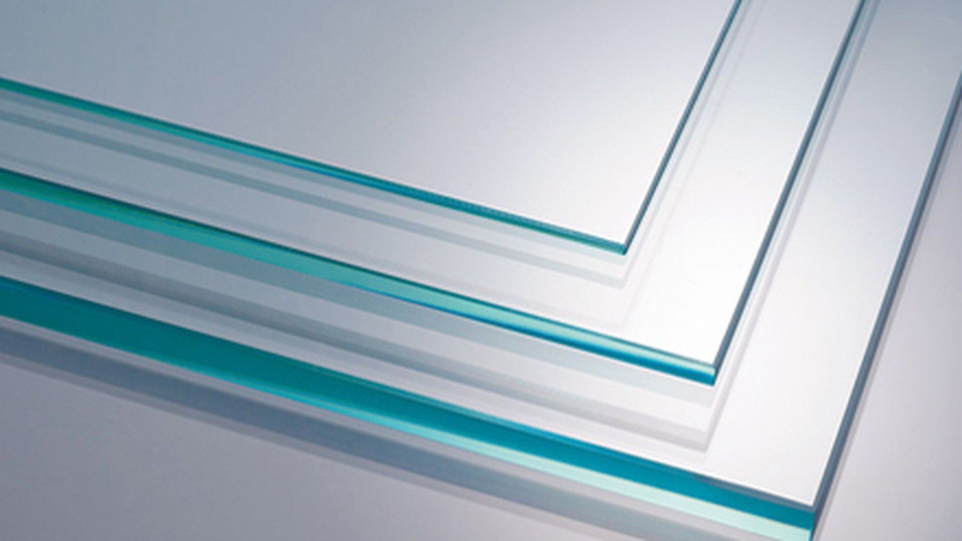 Glass panes seen edge-on, where a laminated build-up reads as more than one sheet of glass with an interlayer between the plies.