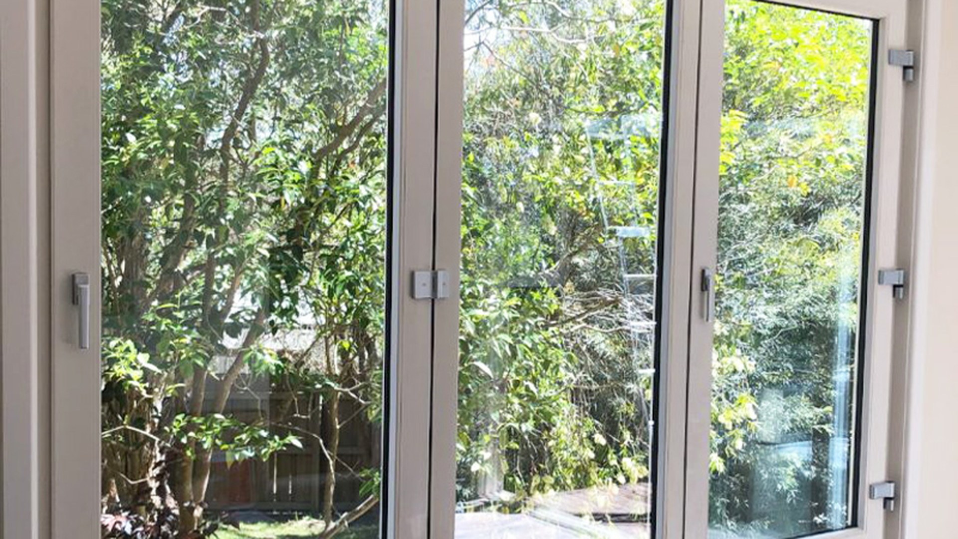 Three opening uPVC sashes shown in the open position, the configuration that decides how much air the room actually gets.